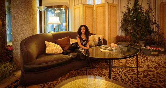 Sipping a coffee in the lobby at The Four Seasons Hotel, Milan